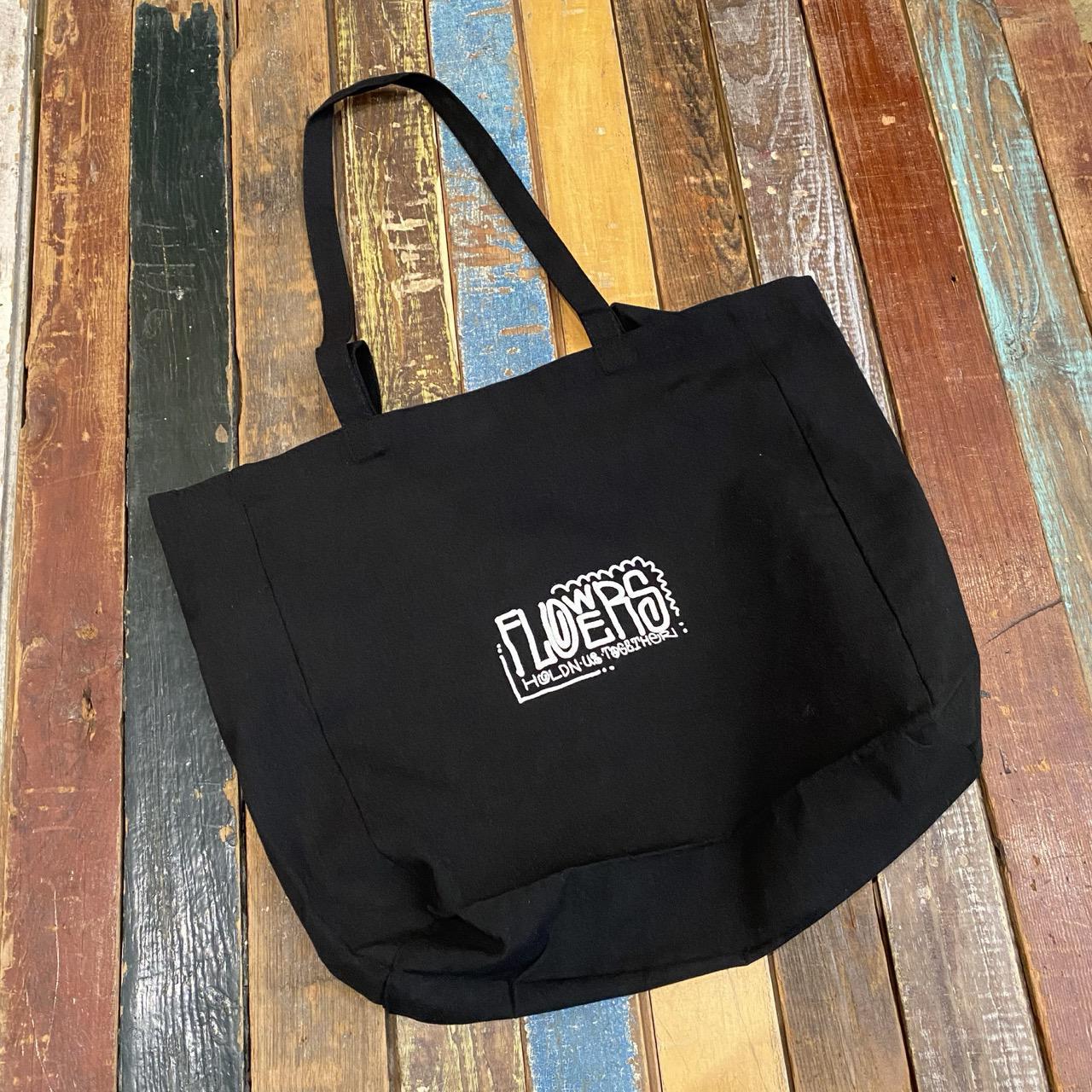 Flowers Holding Us Together Tote Bag