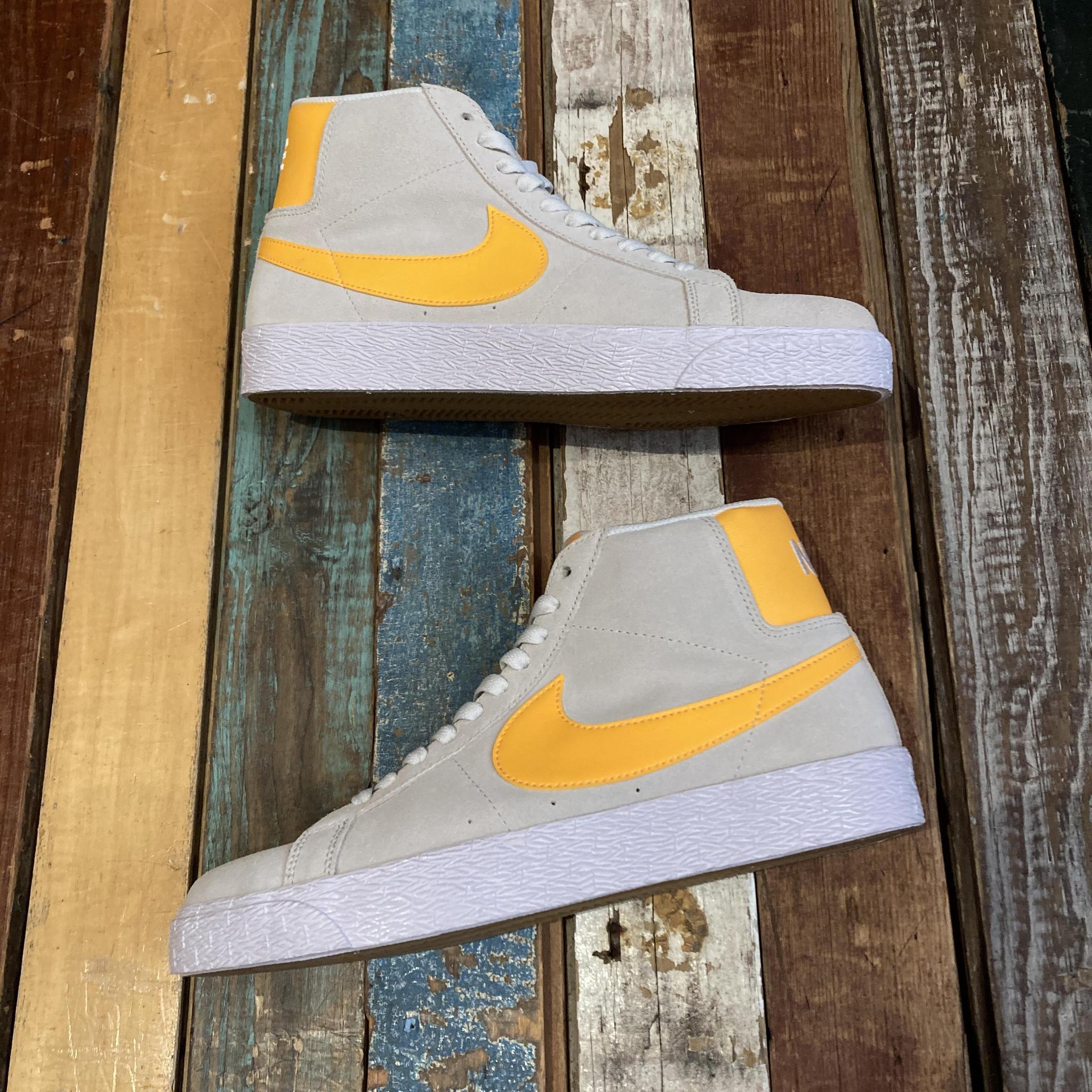 Nike shop yellow check